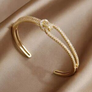 Cubic zirconia knot design cuff bracelet